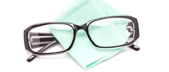 photodune-5167221-eye-glasses-with-cleaning-cloth-isolated-on-white-background-xs