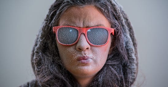 Woman wearing sunglasses during the winter.