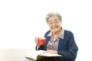 woman reading & drinking tea