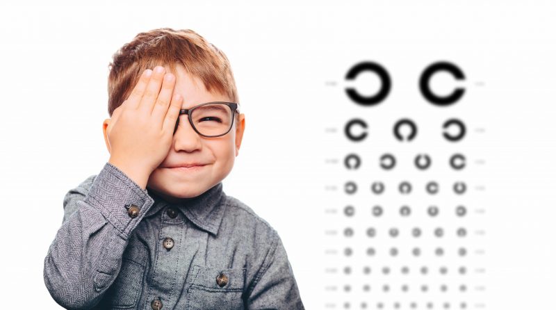 A young boy getting an eye exam